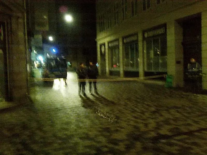 night street with police tape and people